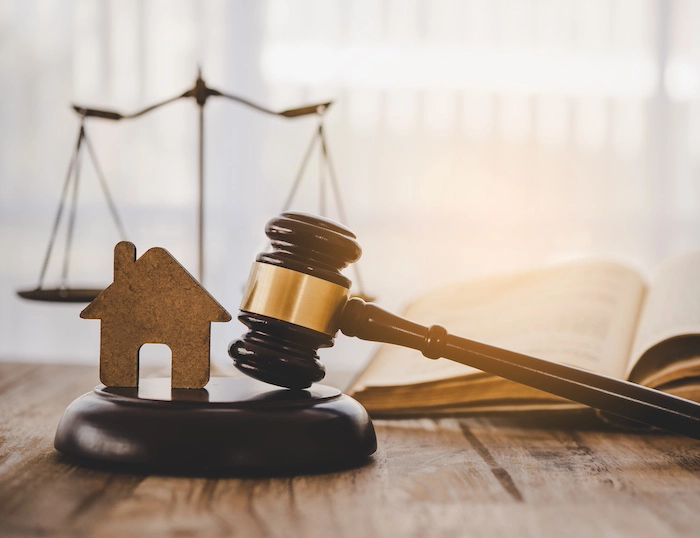 Real Estate Law Model of house and gavel.